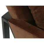 Detail of the left armrest showing velvet upholstery texture and neat stitching