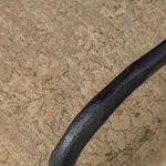 Tight detail of hammered black metal armrest texture