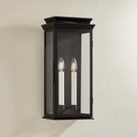 Louie Sconce angled slightly more side view on beige wall emphasizing black backplate and glass edges