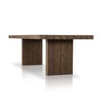 Close-up detail of slab wood edges and corner joints on brown wood dining table