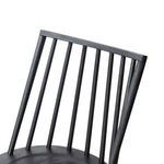 Tilted close-up of curved backrest with detailed visible oak wood grain texture