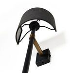 Close-up view of Maurice Sconce curved black shade with textured matte finish