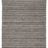Handwoven indoor/outdoor area rug with black, gray, and rust tan tones, featuring black fringe on short edges.