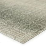 Close-up showing low pile texture and hand-loomed weave of ombre gray and beige rug