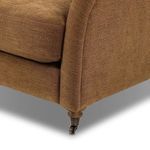 Close-up showing tapered armrest shaping and upholstery texture on Lynne Sofa.