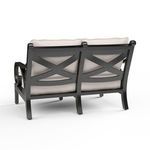 Back view highlighting the crisscross metal design and slightly curved legs of the loveseat frame