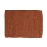 Rust-colored woven cotton placemat with subtle texture and fringed edges