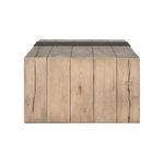 End view of Danica Coffee Table highlighting vertical oak wood planks and texture detail with black iron strip on top