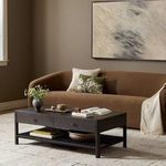Zuma Coffee Table styled in living room with brown sofa, rug, and abstract wall art