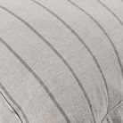 Close-up of woven pinstripe texture and natural linen fibers on sham fabric