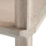Close-up of corner joint showing textured chevron-pattern oak grain on shelf and leg