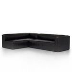 Black leather sectional angled to highlight plush seating and arm shape
