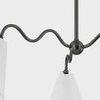 Close-up of black metal squiggly arms connecting to white linen shade
