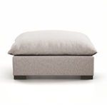 Close-up of ottoman back showing slightly recessed legs and fabric grain