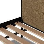Close view of wooden slat ends resting on black iron support beam beneath the mattress area