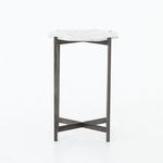 Slim silhouette of Adair table photographed against white background emphasizing minimalist leg design