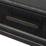 Detail of drawer interior showing black wood finish and clean edges