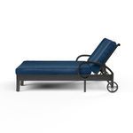 Side view showing adjustable backrest raised at an angle and chaise wheels on Monterey Double Chaise