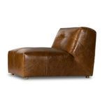 Side profile view showing the chair’s smooth leather texture and slightly angled backrest