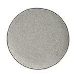 Top view of ottoman showing circular shape and uniform gray woven fabric