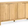 Angled view showing side panels and four door oak sideboard with sturdy block legs