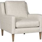 Josie Accent Chair angled view showing rounded backrest and wooden legs in flaxen stone finish