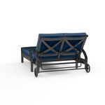 Rear view highlighting the cross back design and wheel details on the Monterey Double Chaise