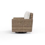 Side profile highlighting chair’s rectangular armrest and cushioned back