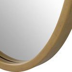 Close-up of gold mirror frame texture showing subtle brushed finish