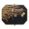 Top view showing entire floral pattern of gold flowers and leaves on black octagonal lid