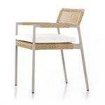 Side angle view of the outdoor dining armchair showing armrest details and frame design
