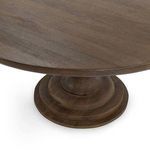 Close-up angled view highlighting tabletop edge and the layered circular base of pedestal