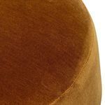Close-up of top edge showing dense rust velvet fabric and fine upholstery stitching