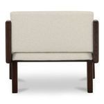 Rear view showing chair backrest with concealed seams and wood legs supporting seat