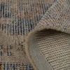 folded edge showing thickness and underside texture of hand woven rug