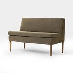 Dining banquette shown at an angled side view highlighting cushion depth and leg placement