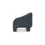 Tuva Accent Chair side profile highlighting the sloped back and rounded arm design