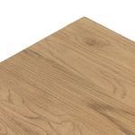 Close-up angled view of table top surface highlighting natural knots and patterns in oak