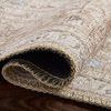 Folded section of Loren Sand Taupe rug emphasizing soft texture and delicate beige tones