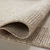 Folded corner highlighting rug’s tightly woven polypropylene texture and thickness