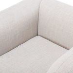 Close-up of armrest fabric texture with visible weave and stitching details