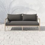 Sherwood sofa front view outdoors on light stone patio without shadow pattern