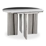Celia dining table shown from a three-quarter angle highlighting the triangular configuration of its marble legs