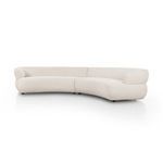 Side angle view highlighting smooth rounded armrest and flowing curved back of sectional sofa