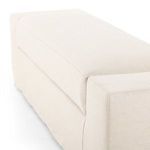 End close-up showing bench arm block with crisp stitching details on slipcover