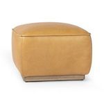 Rear angle showing leather upholstery wrapped smoothly around edges and base