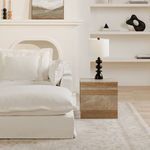 Styled modern living room scene featuring Rosa table beside white sofa with black lamp on top.