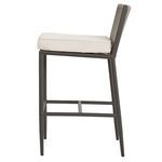 Side view of Pietra Counterstool showing flat seat cushion thickness and metal footrest