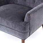 Detailed close-up of seat cushion and front armrest seam stitching