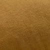 Close-up of the gold velvet fabric highlighting the soft, plush texture
